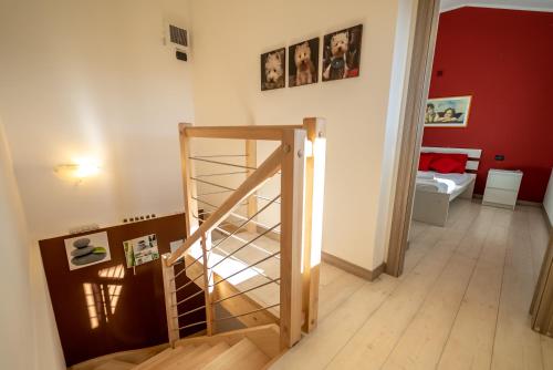 a room with a staircase and a room with a bedroom at Chalet la Cà del Fermo in Perledo