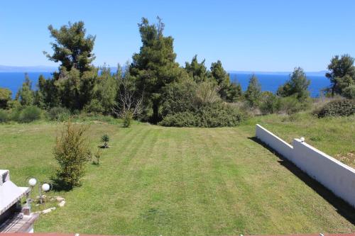 a garden with a view of the ocean at Petra in Afitos