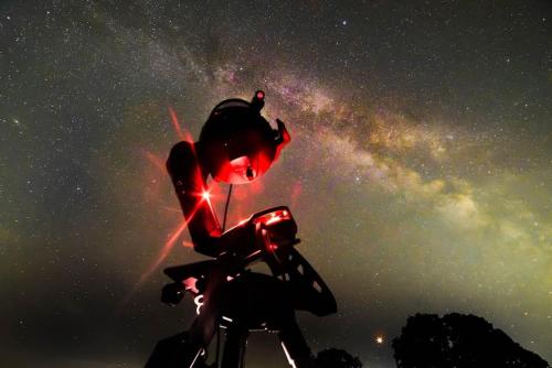 a starry night with a person on a motorcycle at The Annex, Westerlands, Graffham in Graffham
