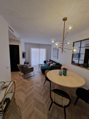 a living room with a table and a couch at Mirador de Sanlucar 9 in Sanlúcar de Barrameda