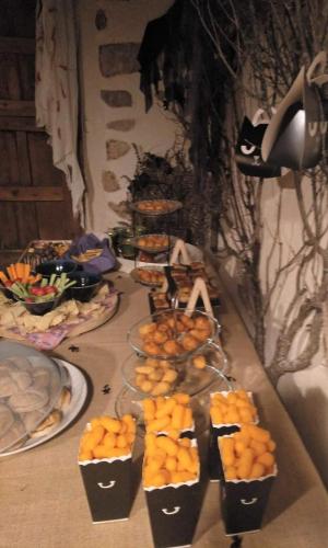 a table with several plates of food on it at La Casona de Castilnovo - Gay Men Only in Valdesaz