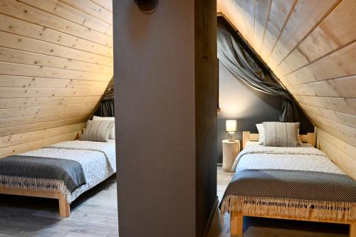 Кровать или кровати в номере Apartament u Kowalczyków