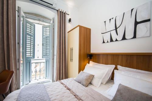 a bedroom with a bed and a large window at Studio Centre in Split