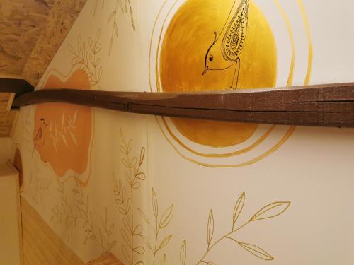 a shelf on a wall with a painting on it at Linda House in Casais de São Mamede