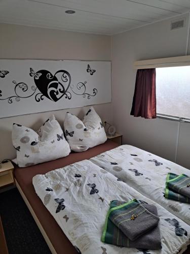 Postel nebo postele na pokoji v ubytování An der Eiche