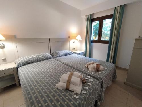 Posteľ alebo postele v izbe v ubytovaní APARTAMENTO DOS DORMITORIOS BAJO, VISTAS PISCINA