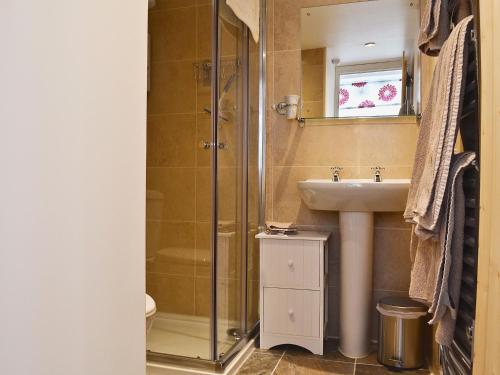 a bathroom with a shower and a sink at The Briar in Idridgehay