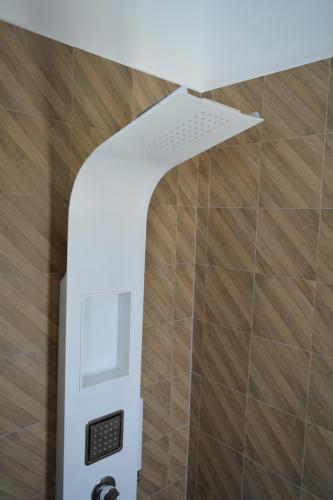 a white ceiling in a bathroom with wooden floors at Dimora Mucci in Termoli