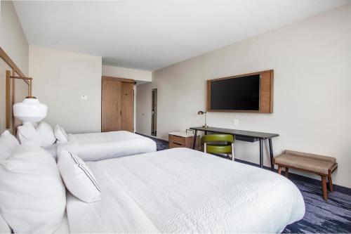 a hotel room with two beds and a television at Fairfield Inn & Suites by Marriott Lebanon in Lebanon