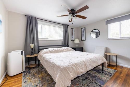 a bedroom with a bed and a ceiling fan at Courtyard View near Valley 2-2a Georgetown Villas in Fairview Park
