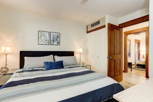 a bedroom with a large bed with blue pillows at 7th Mountain Bliss in Bend