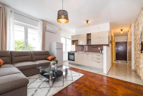 a living room with a couch and a table at IL MURO apartment in Zadar