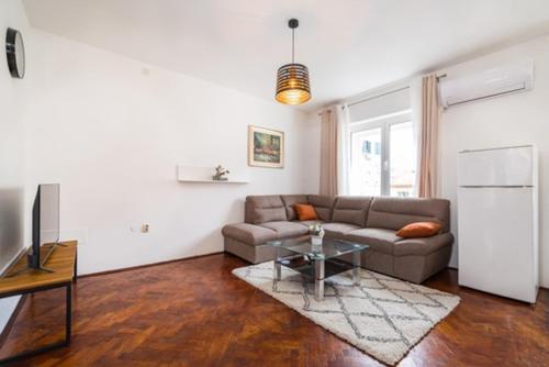 a living room with a couch and a table at IL MURO apartment in Zadar