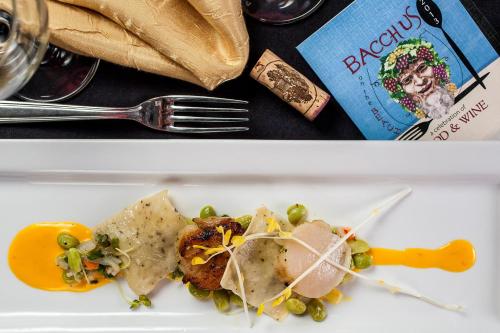 a white plate with food on a table at Resort at Longboat Key Club in Sarasota