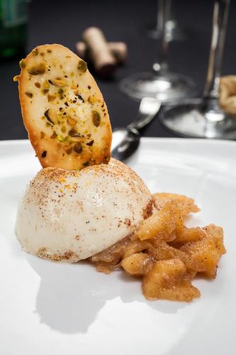 a white plate with a piece of food and fries at Resort at Longboat Key Club in Sarasota