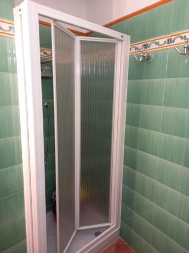 a shower with a glass door in a bathroom at La Cialdina - La CONCHIGLIA Sirolo Apartment in Sirolo