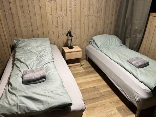 Postel nebo postele na pokoji v ubytování Skaidi Lodge - Modern Cabin Luxury - 6 beds