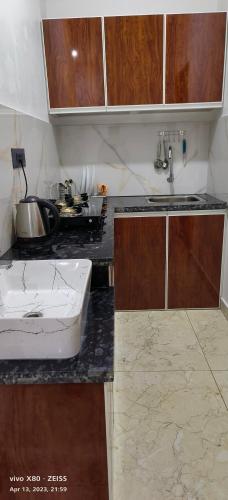 a kitchen with a sink and a counter top at Oman house 2.O in Ernakulam