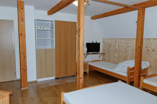 a room with two bunk beds and a tv at Rokytnice 434 in Rokytnice nad Jizerou