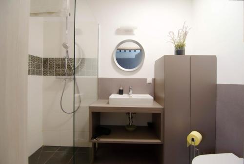 a bathroom with a sink and a shower at MH Apartments in Vienna