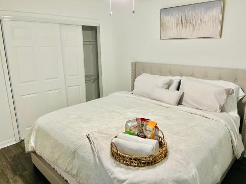 a bedroom with a bed with a basket on it at Deluxe Stays in Kissimmee