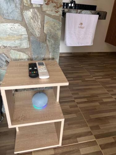 a table with a remote control on top of it at Palmar San Gil in San Gil