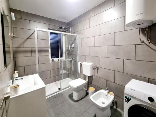 Koupelna v ubytování Apartments Žman
