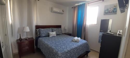 Postel nebo postele na pokoji v ubytování Residencial Palma De Gurabo