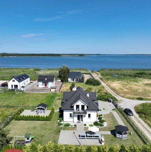 an aerial view of a house with the water at Villa Bella Zastan Sauna & Jacuzzi in Międzywodzie