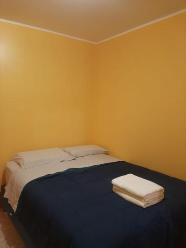 En eller flere senge i et værelse på Casa La Ruta Pisco