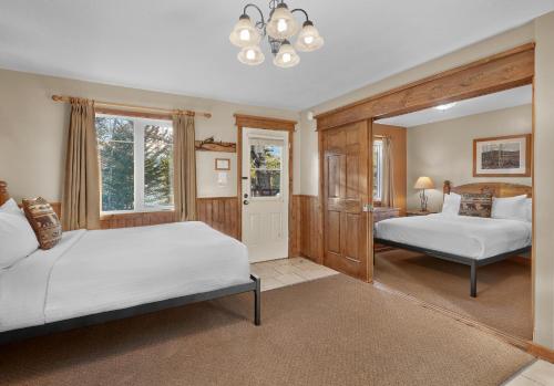 a bedroom with two beds and a window at Patricia Lake Bungalows in Jasper