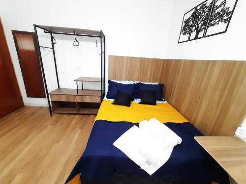 Cama o camas de una habitación en Studio Liberdade Paulista DB2