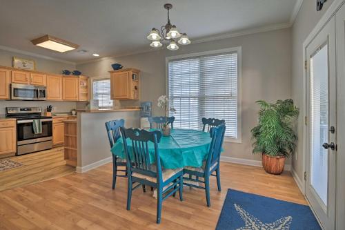 a dining room with a table and chairs in a kitchen at Large Home with Hot Tub and Pool 500 ft to the Beach in Myrtle Beach