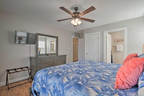 a bedroom with a bed and a ceiling fan at Large Home with Hot Tub and Pool 500 ft to the Beach in Myrtle Beach
