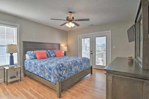 a bedroom with a bed and a ceiling fan at Large Home with Hot Tub and Pool 500 ft to the Beach in Myrtle Beach