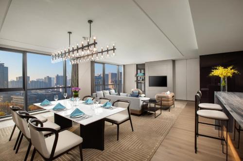 a dining room with a table and chairs at Crowne Plaza Zhengzhou High Tech Zone, an IHG Hotel in Zhengzhou