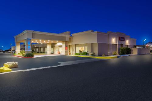 a gas station at night with an empty parking lot at Red Roof Inn Pecos in Pecos