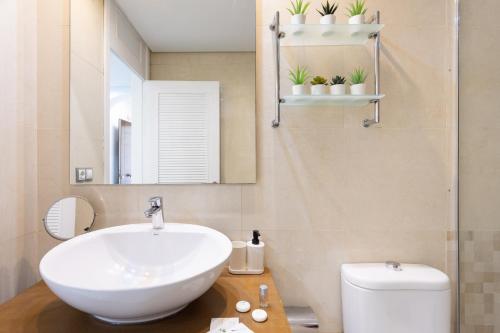 a bathroom with a sink and a toilet at apartamento paradise luxury in Playa Paraiso