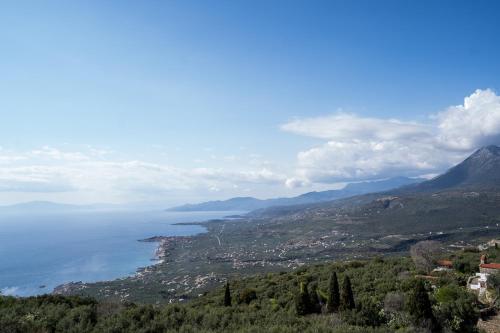 a view of a city and a body of water at Sea & Mountain Serenity in Plátsa
