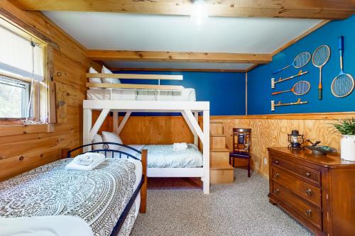 a bedroom with a bunk bed and blue walls at McKenzie Highlands in Watkins Glen
