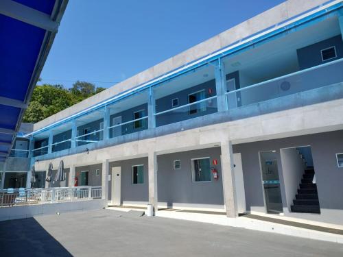 an external view of a building with its doors open at Pousada Verçosa - Rota Ecológica dos Milagres in Passo de Camarajibe