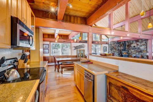 a large kitchen with a table and a dining room at Peaceful Forest Retreat in Carnelian Bay