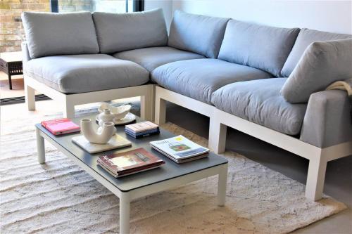 a living room with a couch and a coffee table at New Spacious 1 Bedroom Apartment Rosebery in Sydney