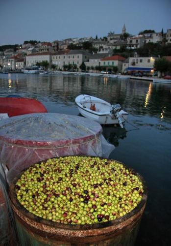two containers filled with food in a body of water at Villa Libana in Povlja