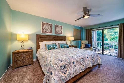a bedroom with a large bed and a balcony at Lagoon Villa 19 - Lagoon Lifestyle! Center of Wild Dunes! in Isle of Palms