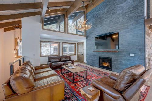 a living room with leather furniture and a fireplace at Extra Spacious 2BR Cabin w Office and Outdoor Deck in Incline Village