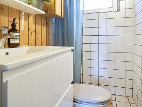 a bathroom with a sink and a toilet at Holiday home Aakirkeby XLIV in Vester Sømarken