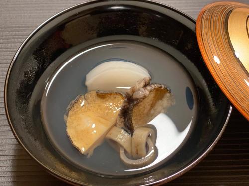 a bowl of food with meat and ice cream at Wakkanupuri Resorts in Teshikaga
