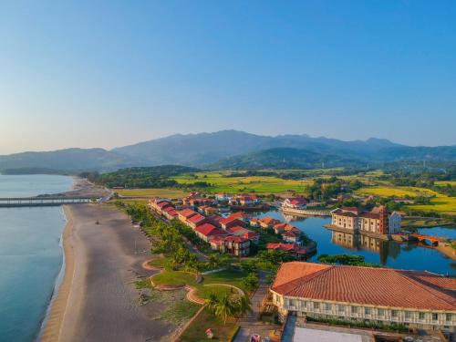 an aerial view of a town next to the water at Las Casas Filipinas de Acuzar in Bagac
