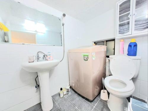 a bathroom with a toilet and a sink at Two bedroom Apt Hongik University in Seoul